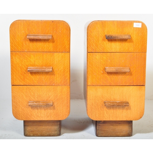 1330 - A pair of  1930's oak Art Deco bedside pedestal chests of drawers. Each chest with an inset plinth b... 