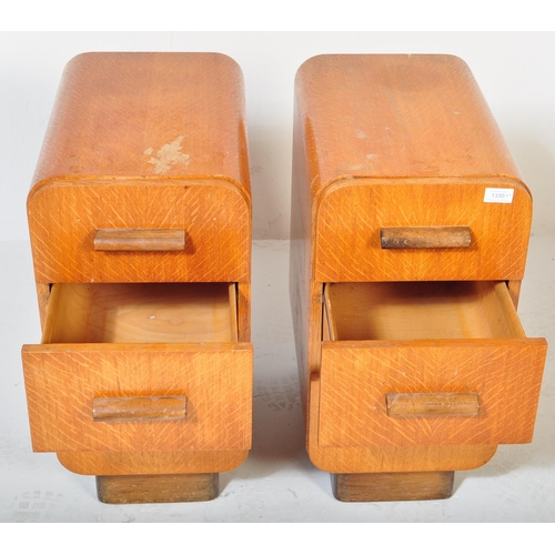 1330 - A pair of  1930's oak Art Deco bedside pedestal chests of drawers. Each chest with an inset plinth b... 