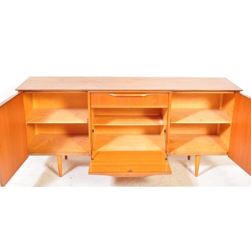 1333 - British Modern Design  - Mid century teak wood sideboard credenza. Raised on tapering legs with wide... 