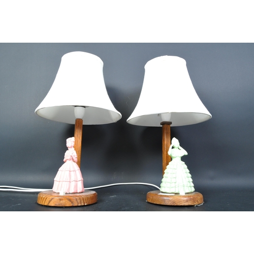 1335 - A pair of 1930's Art Deco oak and crinoline lady porcelain figurine table lamps - Lights. Oak uprigh... 