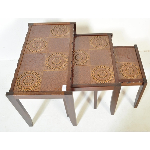 1337 - A Mid century Danish inspired 20th century teak wood and tile top nest of tables. Raised on tapering... 