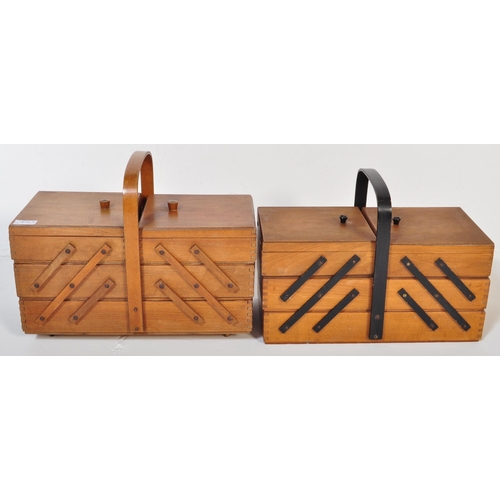 1349 - A pair of retro vintage mid 20th Century light wood cantilever sewing boxes with carrying handles at... 