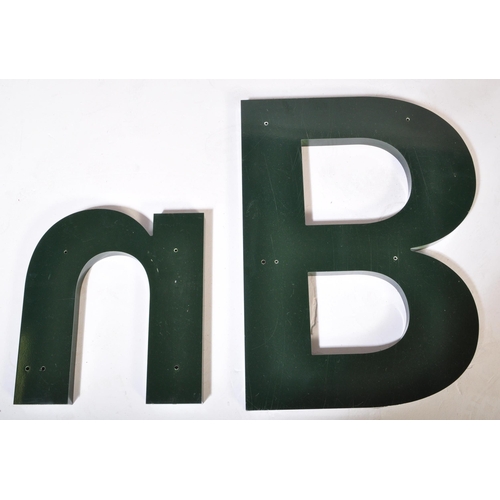 1350 - Set of four large green alphabet wall mountable letters. two bs a & n. Measures approx. 63cm.