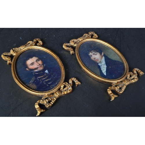 1437 - A pair of vintage 20th Century portraits of two gentlemen. With gilt carved bow frames of oval form ... 