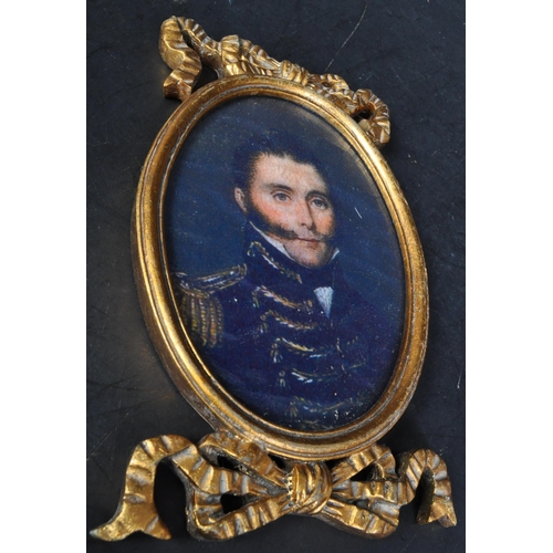 1437 - A pair of vintage 20th Century portraits of two gentlemen. With gilt carved bow frames of oval form ... 