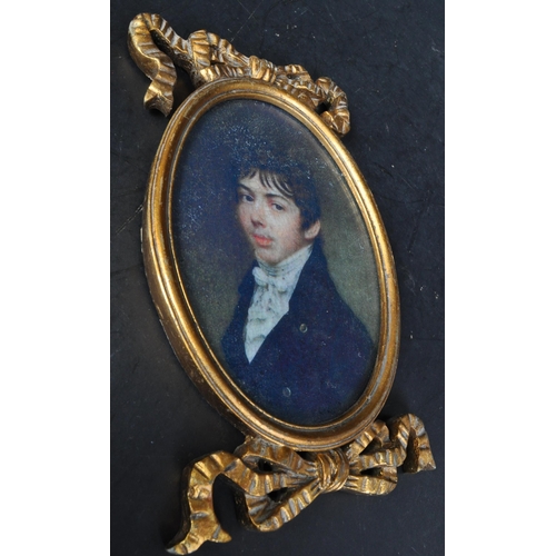 1437 - A pair of vintage 20th Century portraits of two gentlemen. With gilt carved bow frames of oval form ... 