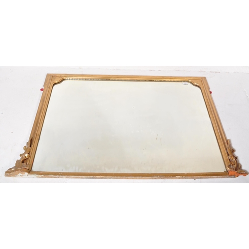 1451 - A large 19th century late Victorian gilt mirror having moulded gilded frame with relief decoration t... 