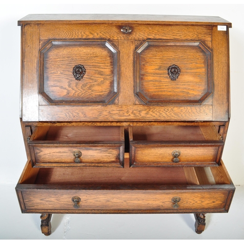 1454 - A 19th century Victorian Jacobean Revival oak bureau having fall front door to top with octagonal pa... 