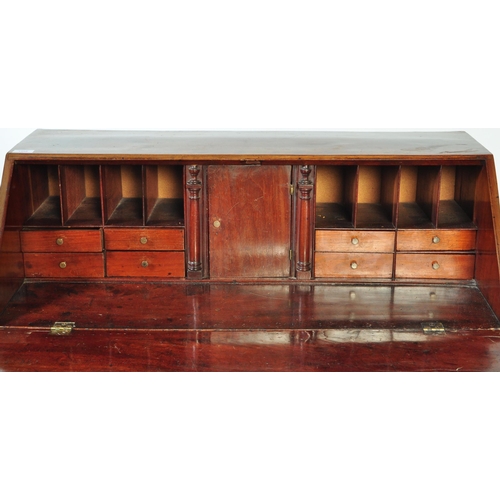 1458 - An 18th Century George III mahogany bureau desk with hinged lid opening to reveal a fitted interior ... 