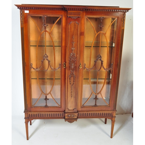 1459 - A large Edwardian mahogany china display cabinet raised on tapering legs with spade feet having upri... 