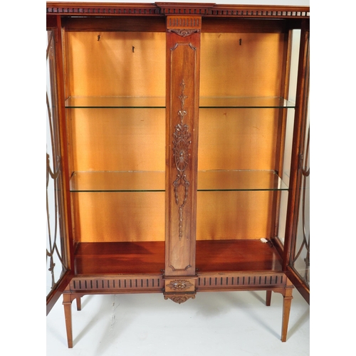 1459 - A large Edwardian mahogany china display cabinet raised on tapering legs with spade feet having upri... 