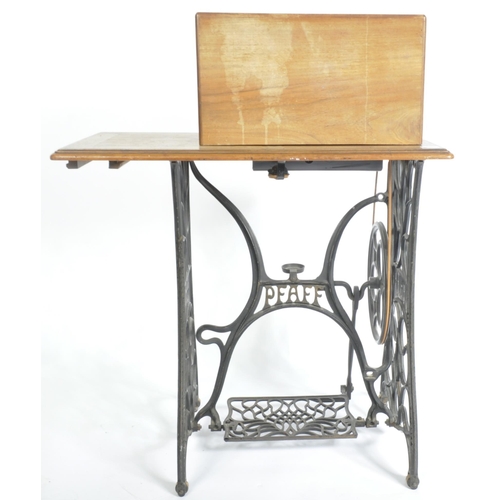 1467 - 19th century mahogany Pfaff sewing machine table. Raised on cast iron treadle base with machine atop... 