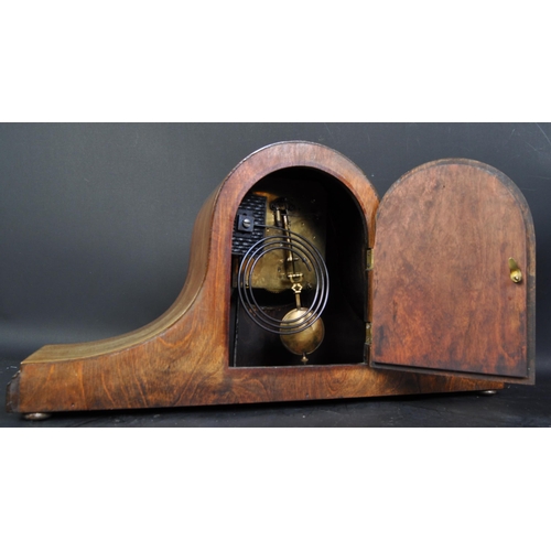 1471 - An Edwardian early 20th century inlaid Napoleon hat shaped mantel clock. The oak mantle clock having... 