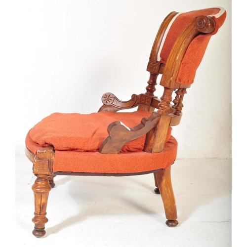 1478 - A Victorian 19th century oak & upholstered nursing chair having a splayed back lower finials detaili... 