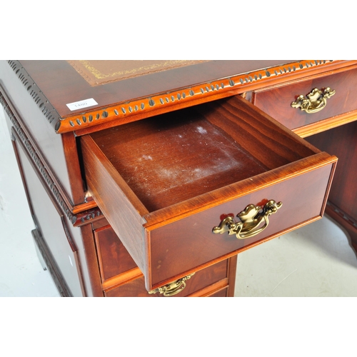 1480 - A George III revival 20th century mahogany and leather twin pedestal desk and filing cabinet. Raised... 