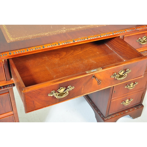 1480 - A George III revival 20th century mahogany and leather twin pedestal desk and filing cabinet. Raised... 