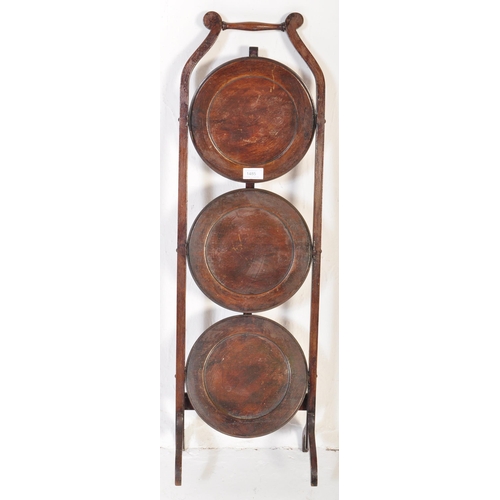 1485 - An early 20th Century circa 1920's mahogany folding cake stand. Having an carry handle to top, three... 