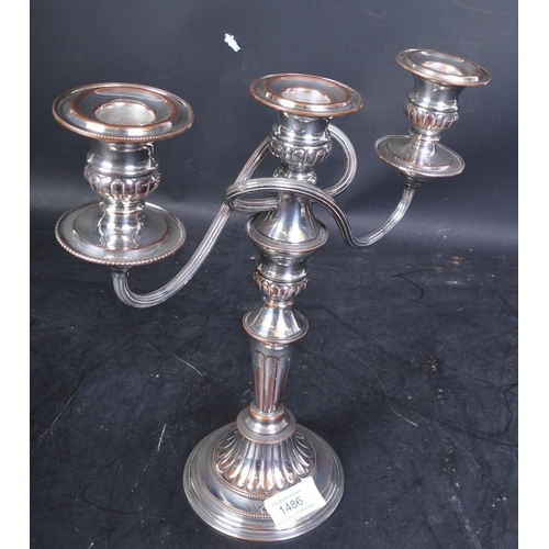 1486 - A vintage 20th Century silver on copper English hand chased candelabra. Having three holder on curve... 