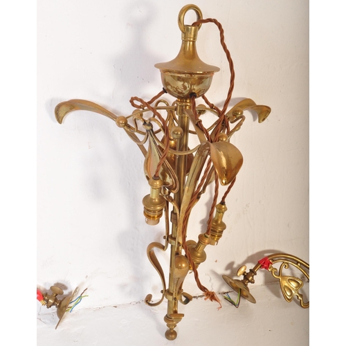 1488 - A 19th Century Art Nouveau brass hanging ceiling light. Having a tapering body with heart decoration... 