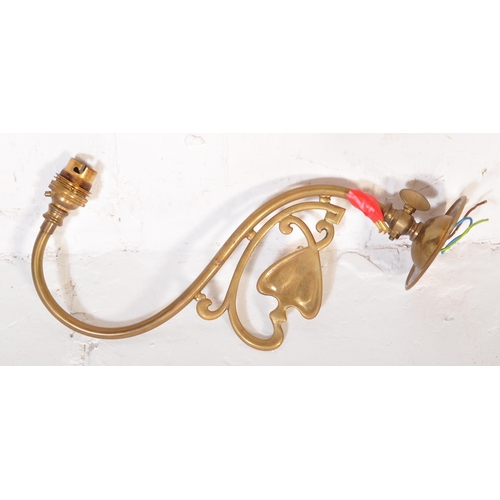 1488 - A 19th Century Art Nouveau brass hanging ceiling light. Having a tapering body with heart decoration... 