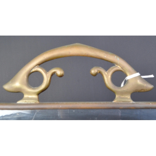 1489 - An early 20th century circa. 1910's Art Nouveau gilt metal fireguard having a scrolled handle atop o... 