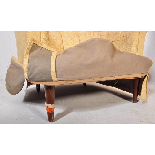 1491 - An early 20th century tub chair / arm chair upholstered in a yellow floral fabric. The chair having ... 