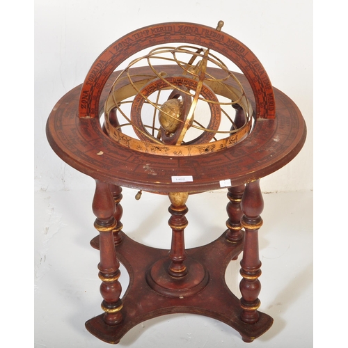 1492 - A 20th century floor standing globe. The brass globe being set within a brass frame within a further... 