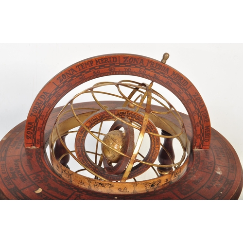 1492 - A 20th century floor standing globe. The brass globe being set within a brass frame within a further... 