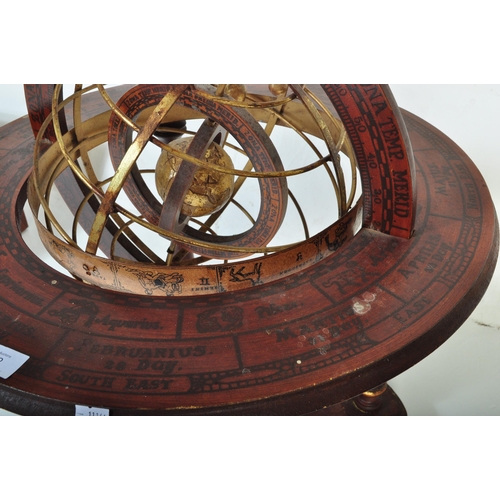 1492 - A 20th century floor standing globe. The brass globe being set within a brass frame within a further... 