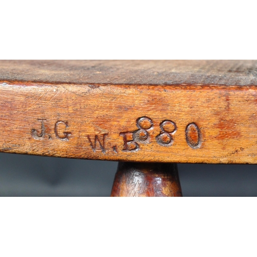 1495 - A early 20th Century elm wood children's chair stool. Having a horseshoe back, with spindles on an o... 