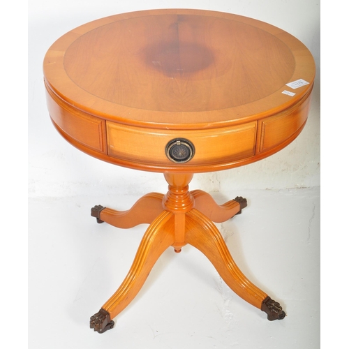 1505 - A pair of vintage 20th century Regency revival yew wood drum side tables. Each table having a circul... 