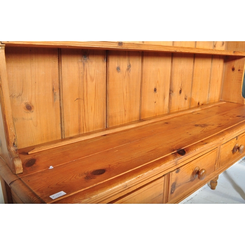 1507 - Victorian 19th century pine Welsh dresser. Raised on turned legs with ring centres having fitted fri... 