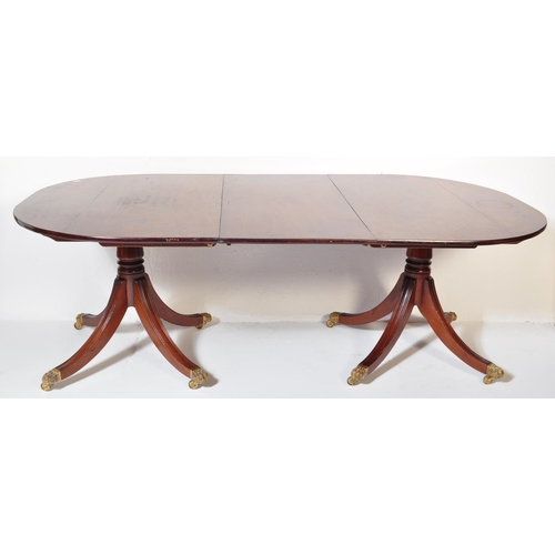 1511 - A George III style 20th century Cuban mahogany pedestal D End dining table having a chamfered top ra... 