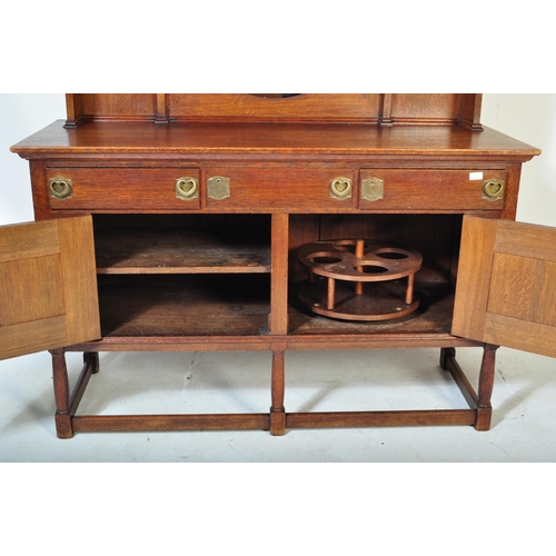 1512 - A 19th century Victorian Arts & Crafts oak sideboard in the manner of Liberty of London. Turned legs... 