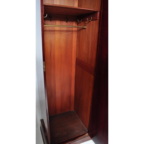 1515 - Edwardian mahogany inlaid triple wardrobe compactum. Raised on plinth base with triple section compr... 