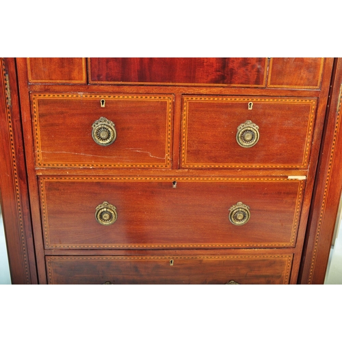 1515 - Edwardian mahogany inlaid triple wardrobe compactum. Raised on plinth base with triple section compr... 