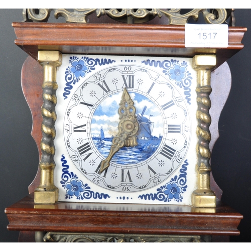 1517 - A vintage 20th century Dutch wall clock having delft tile clock face with roman numeral to chapter r... 