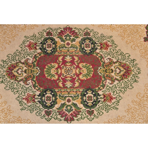 1521 - A vintage 20th Century Persian Islamic floor carpet rug. The lot to include a red, beige & green rug... 