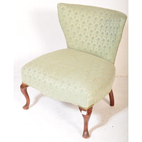 1522 - A vintage early 20th Century nursing chair. Having a trapezium back rectangular over stuff cushioned... 