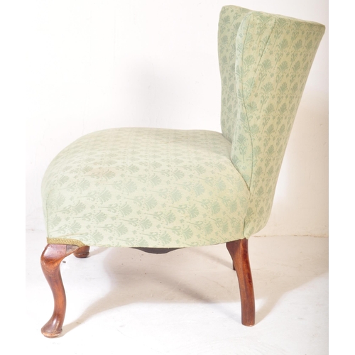 1522 - A vintage early 20th Century nursing chair. Having a trapezium back rectangular over stuff cushioned... 