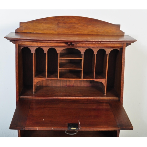 1535 - An early 20th century circa. 1920's Arts and Crafts oak student bureau having a gallery back to top ... 