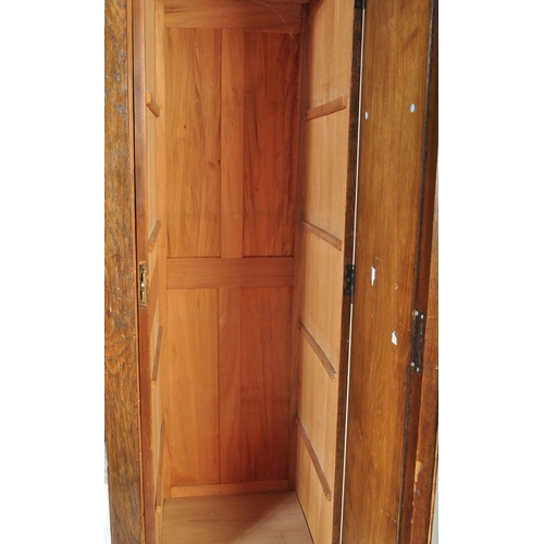 1540 - A large 19th century Victorian oak carved wardrobe having carved details to the door panels with ped... 