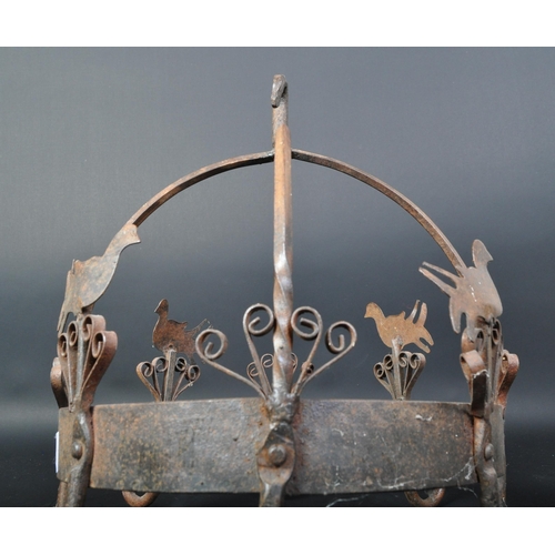 1541 - A Victorian 19th century hanging wrought iron metal pot hook rack with eight hooks and alternating b... 