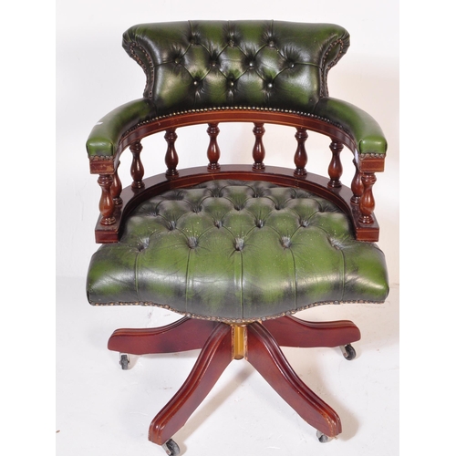 1542 - A 20th century Victorian Revival green leather Chesterfield Captains deep button back yew wood frame... 