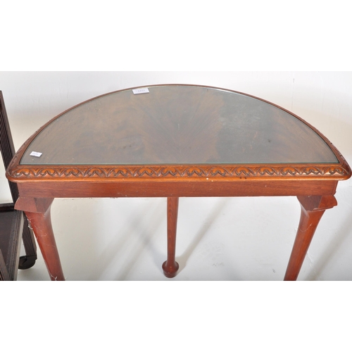 1543 - A 20th century Queen Anne revival walnut half moon console / hall table with glass top raised on cab... 