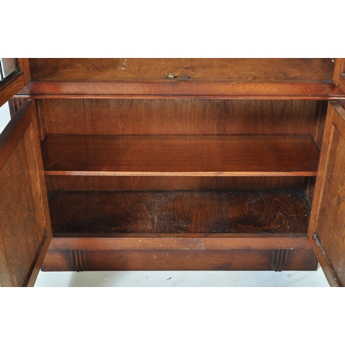 1547 - 1930's Art Deco oak and leaded glass library bookcase cabinet. Raised on plinth base with twin door ... 