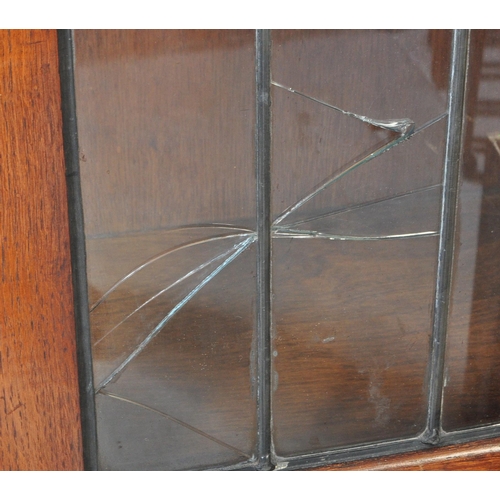 1547 - 1930's Art Deco oak and leaded glass library bookcase cabinet. Raised on plinth base with twin door ... 