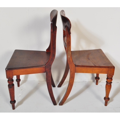 1548 - A pair of 19th century Regency mahogany bar back hall /  dining chairs. Raised on turned legs with p... 