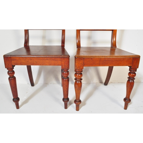 1548 - A pair of 19th century Regency mahogany bar back hall /  dining chairs. Raised on turned legs with p... 