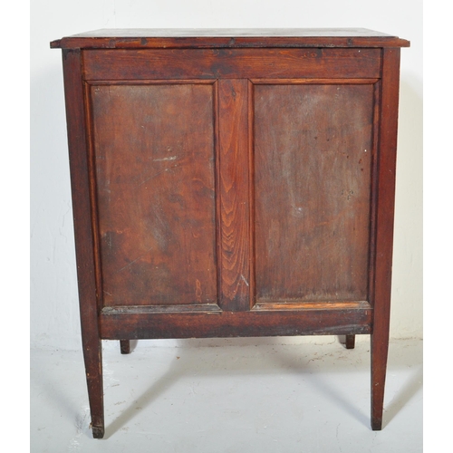 1550 - A 1920's oak Jacobean revival twin door music / hall cupboard being raised on tapering legs with twi... 